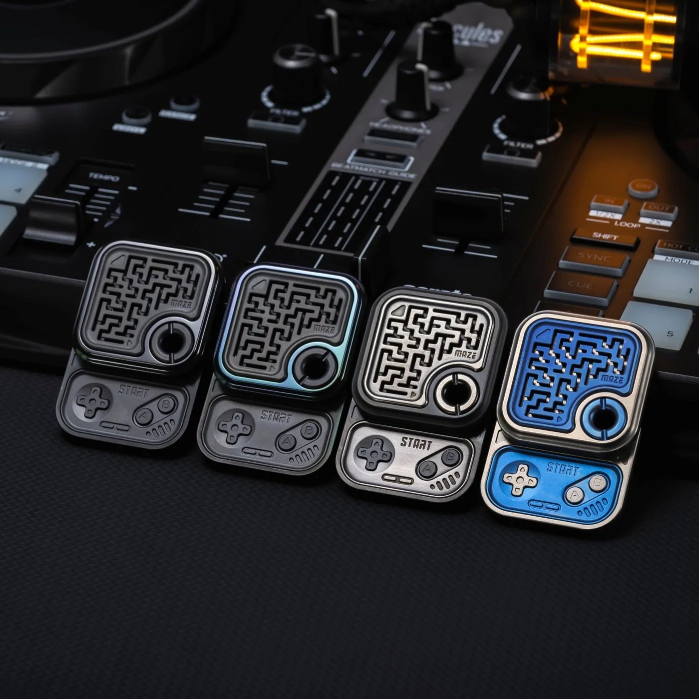A row of 01EDC game-pad sliders with maze faces laid across a mixer