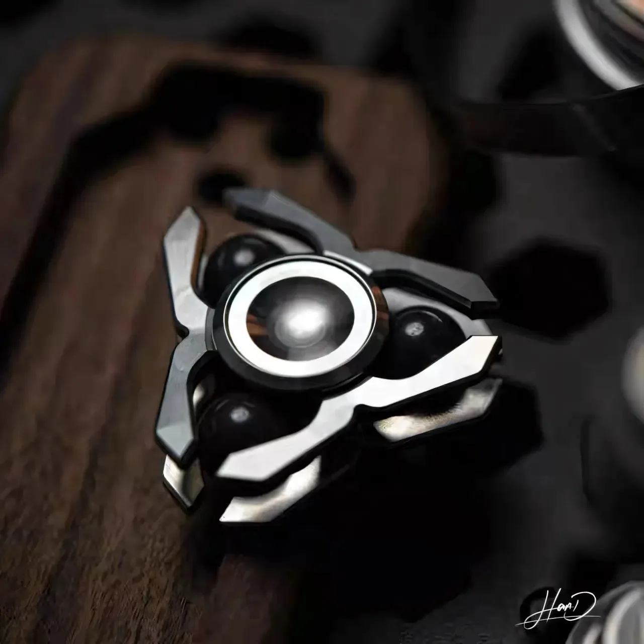 A Hope Studio spinner with a polished centre resting on dark wood