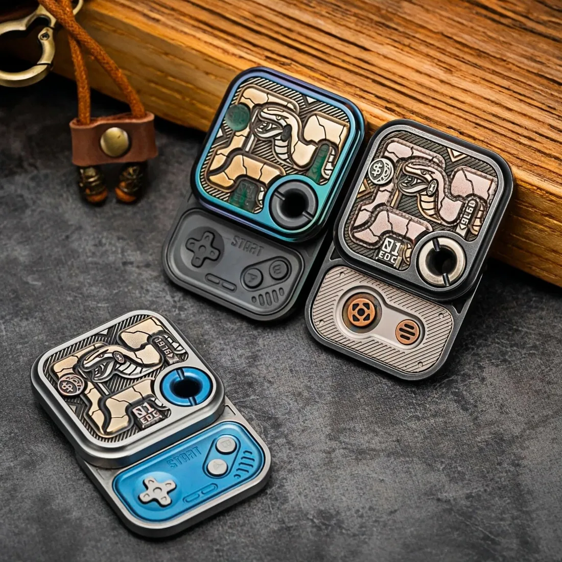 Two 01EDC Maze Block sliders with engraved maze faces and a leather strap