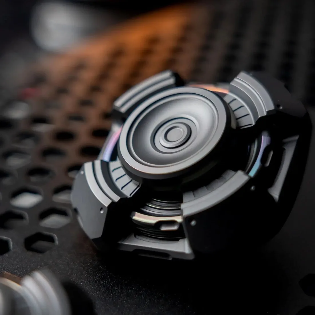 Wanwu Studio NFE Transmitter linkage spinner on a textured black surface